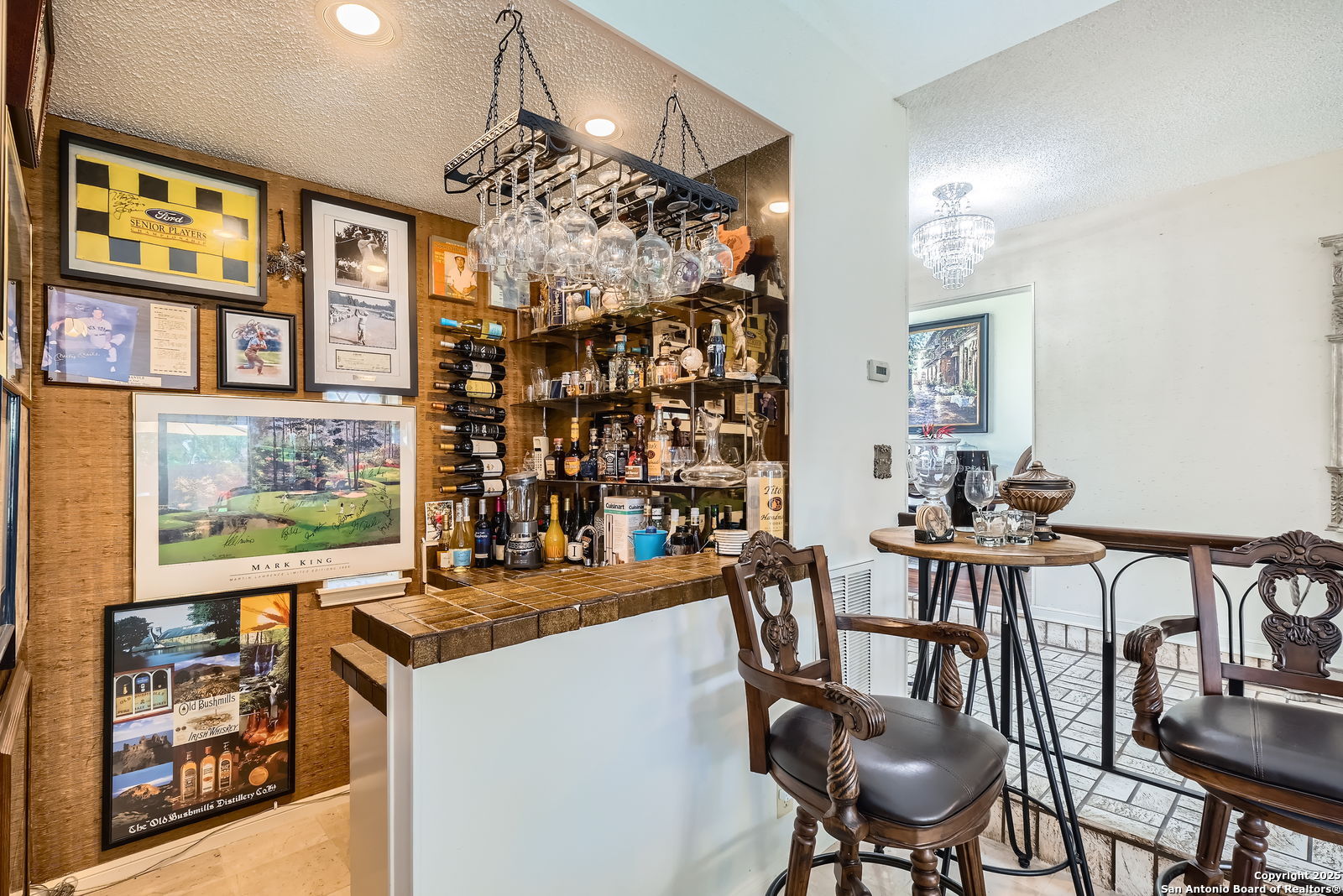 13215 Hunters Spring San Antonio, TX 78230 - Photo 25 of 29 a view of a dining room with furniture and chandelier