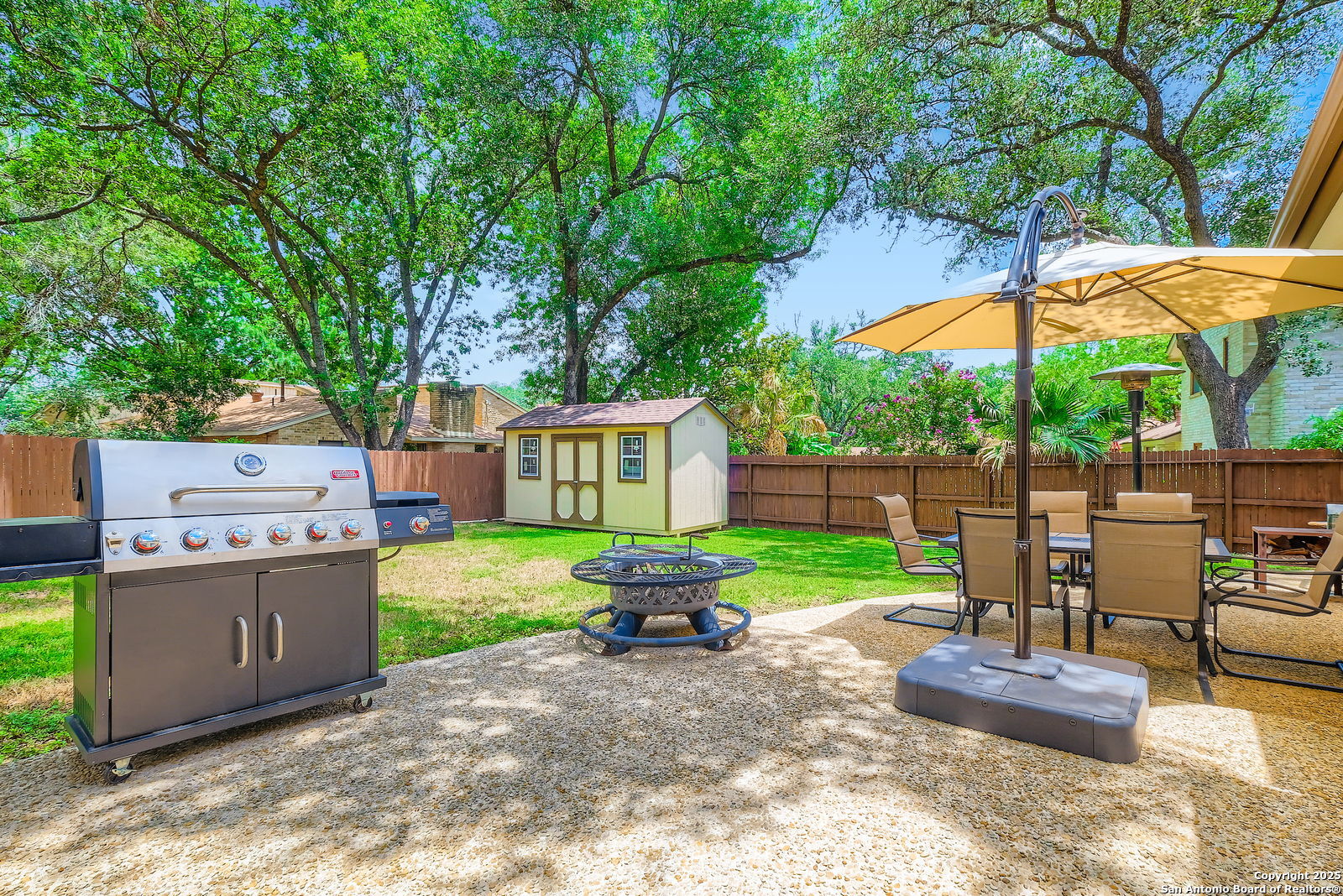 13215 Hunters Spring San Antonio, TX 78230 - Photo 26 of 29 a backyard of a house with yard and outdoor seating