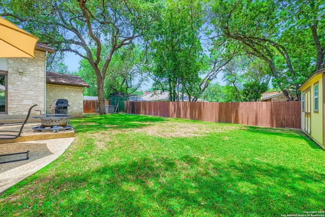 a front view of house with yard and outdoor seating