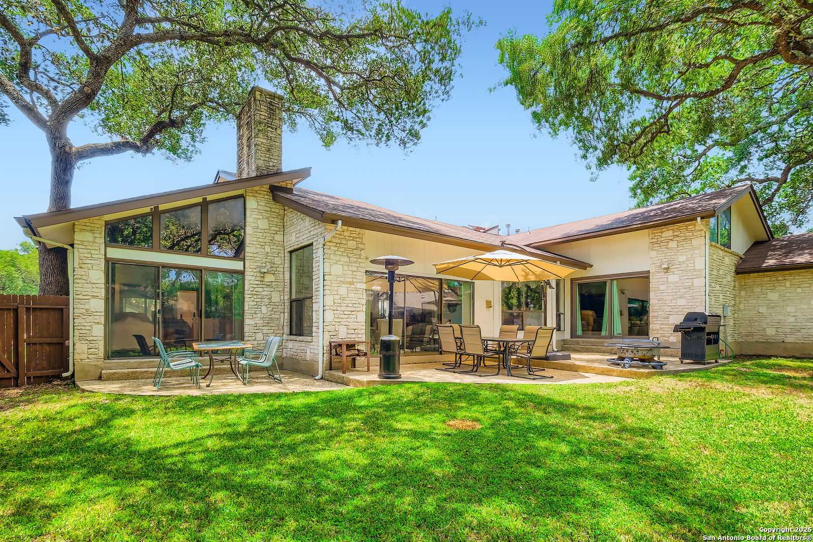 13215 Hunters Spring San Antonio, TX 78230 - Photo 28 of 29 a front view of house with yard and outdoor seating