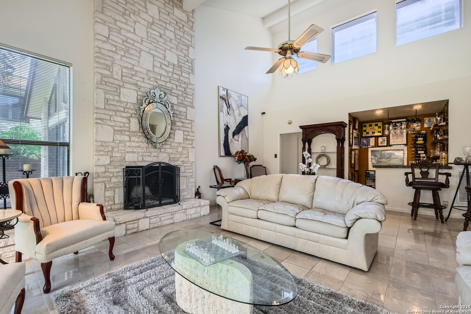 13215 Hunters Spring San Antonio, TX 78230 - Photo 6 of 29 a living room with furniture a fireplace and a large window