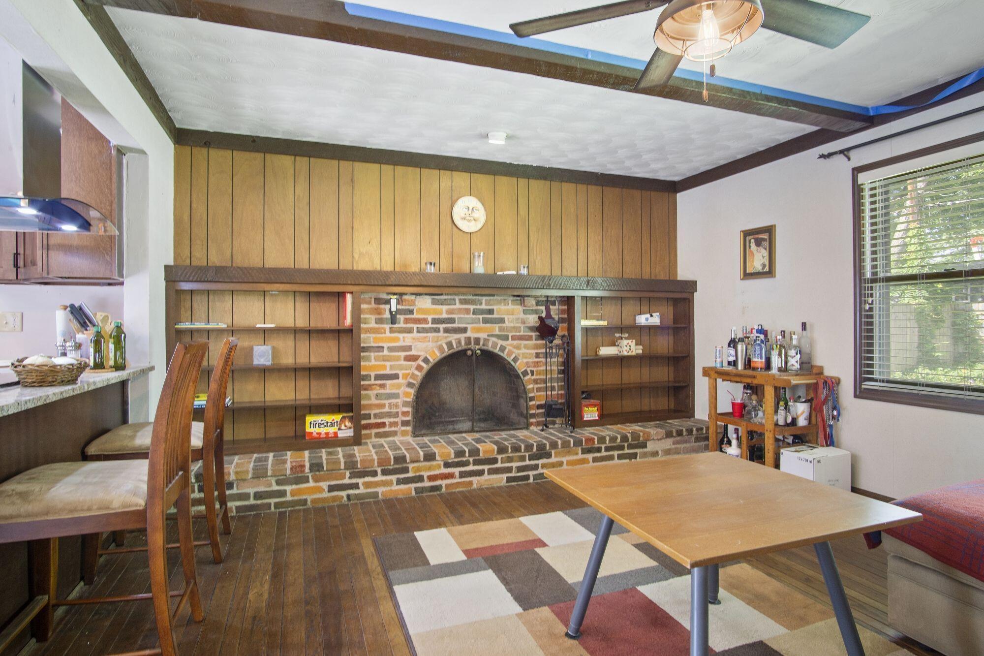 6053 Rocky Rill Road Columbus, OH 43235 - Photo 15 of 28 New 2021 ceiling light/fan. Beamed ceiling. Breakfast bar opens to Kitchen with granite counter top. Raised brick wood burning fireplace.