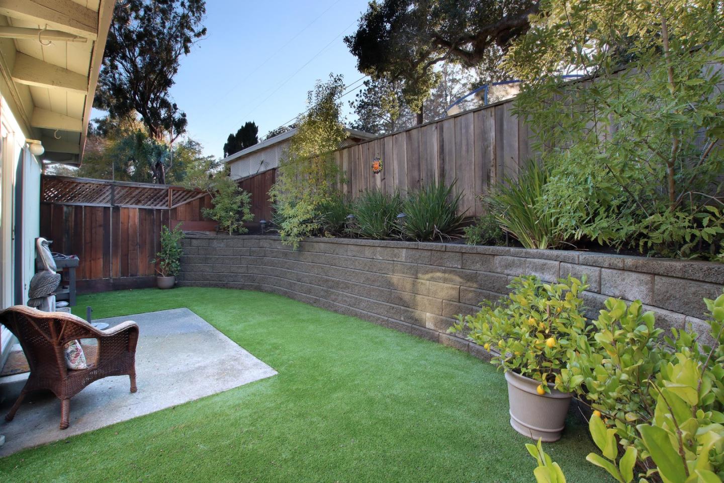 27 Erba Lane Scotts Valley, CA 95066 - Photo 26 of 30 a view of a backyard with chair potted plants and large tree