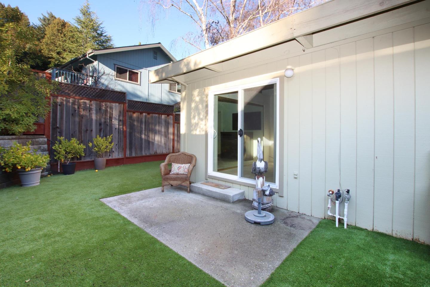27 Erba Lane Scotts Valley, CA 95066 - Photo 27 of 30 a view of a chair and table in backyard of the house