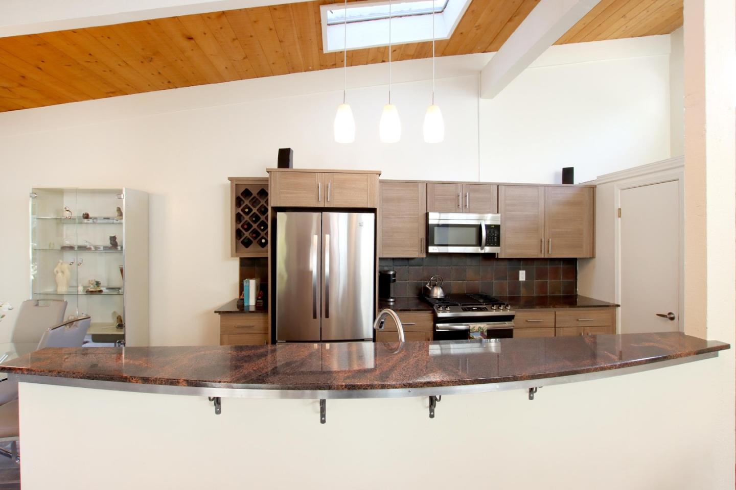 27 Erba Lane Scotts Valley, CA 95066 - Photo 10 of 30 a kitchen with kitchen island a counter top space a sink and appliances