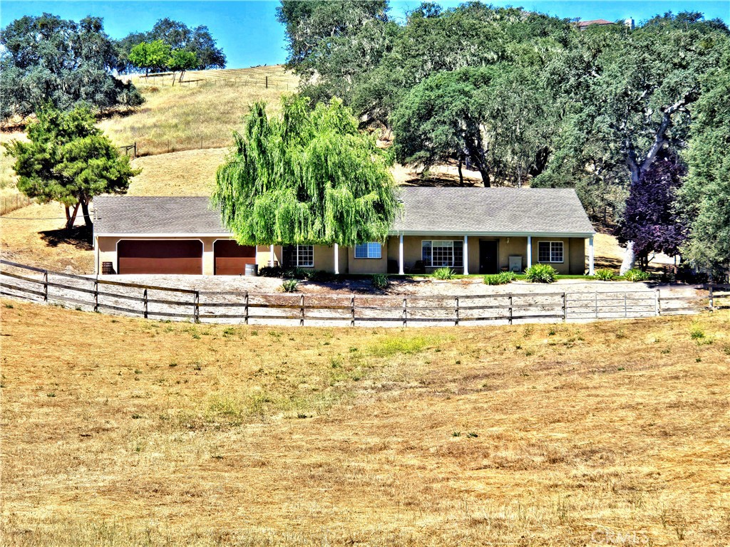 a front view of a building with a swimming pool