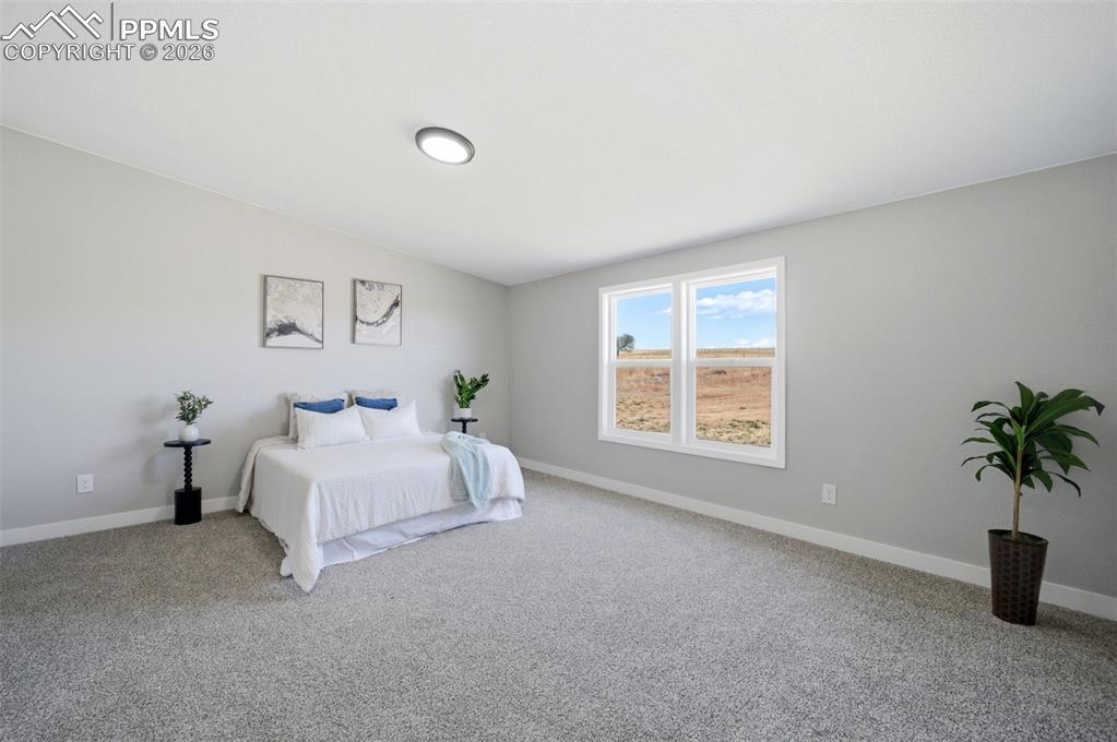 35125 Book Road Yoder, CO 80864 - Photo 8 of 45 a bed room with a bed and a window