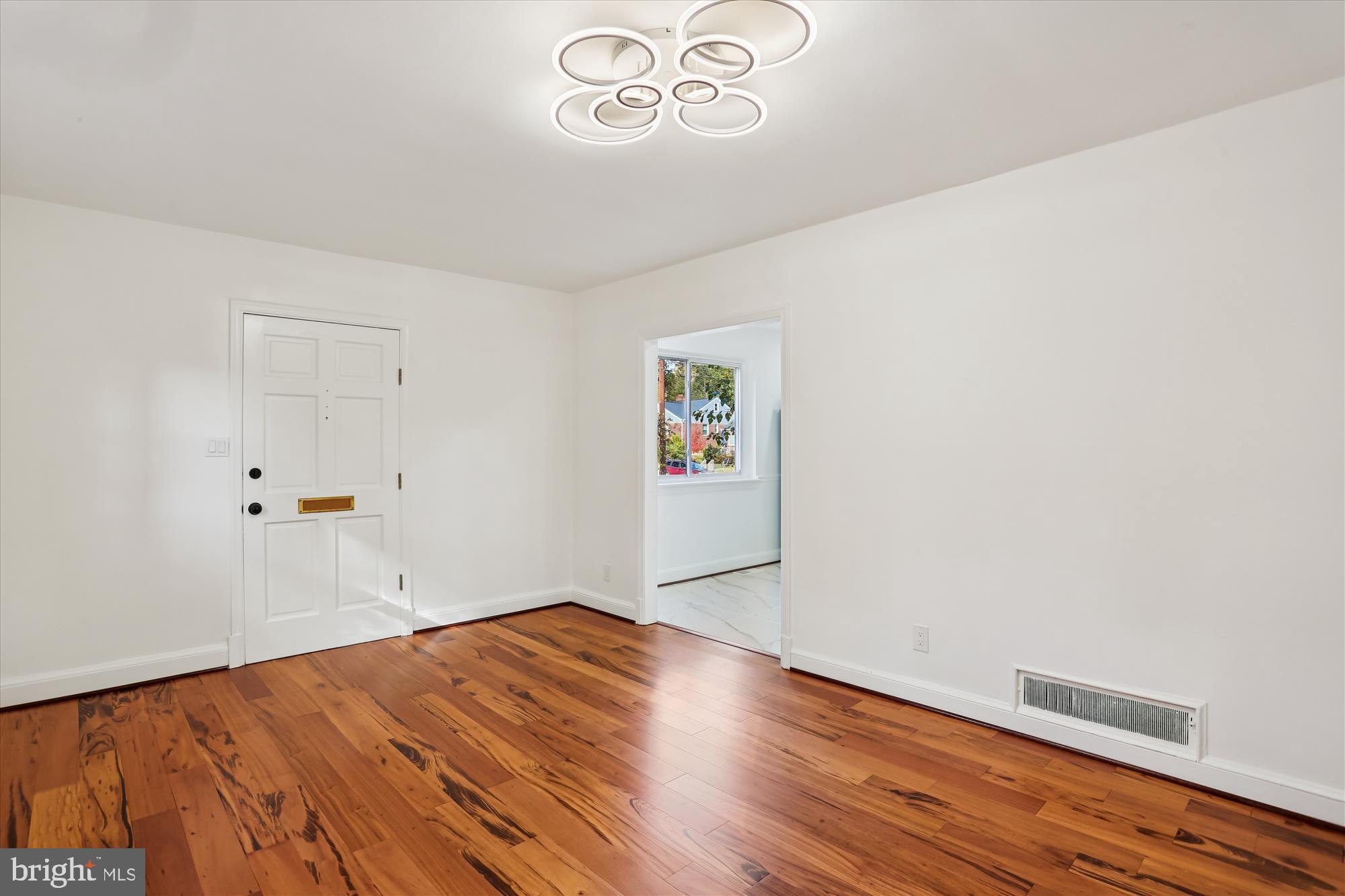 717 Ludlow Street Takoma Park, MD 20912 - Photo 14 of 68 a view of empty room with wooden floor