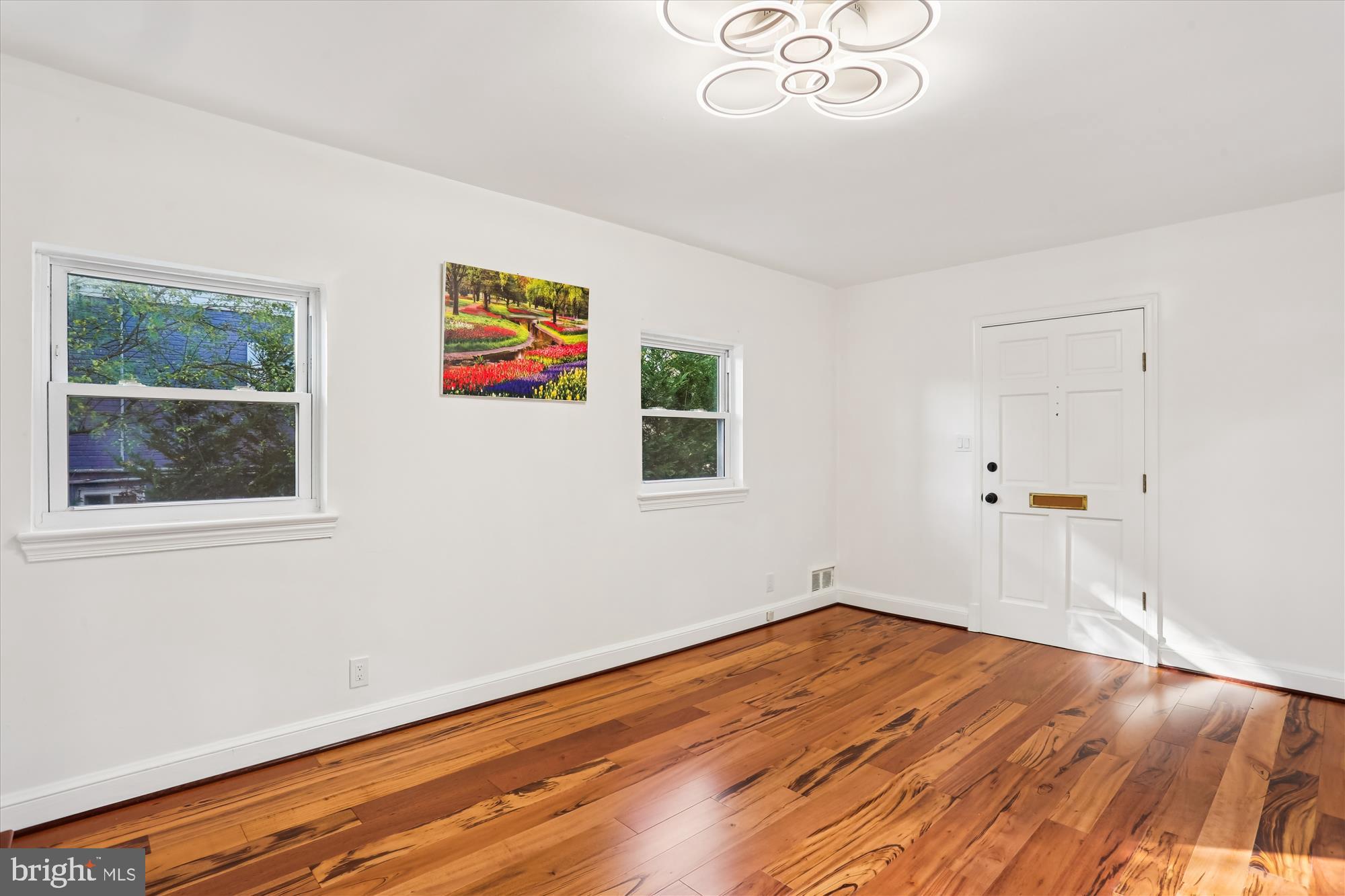 717 Ludlow Street Takoma Park, MD 20912 - Photo 15 of 68 a view of empty room with wooden floor and fan