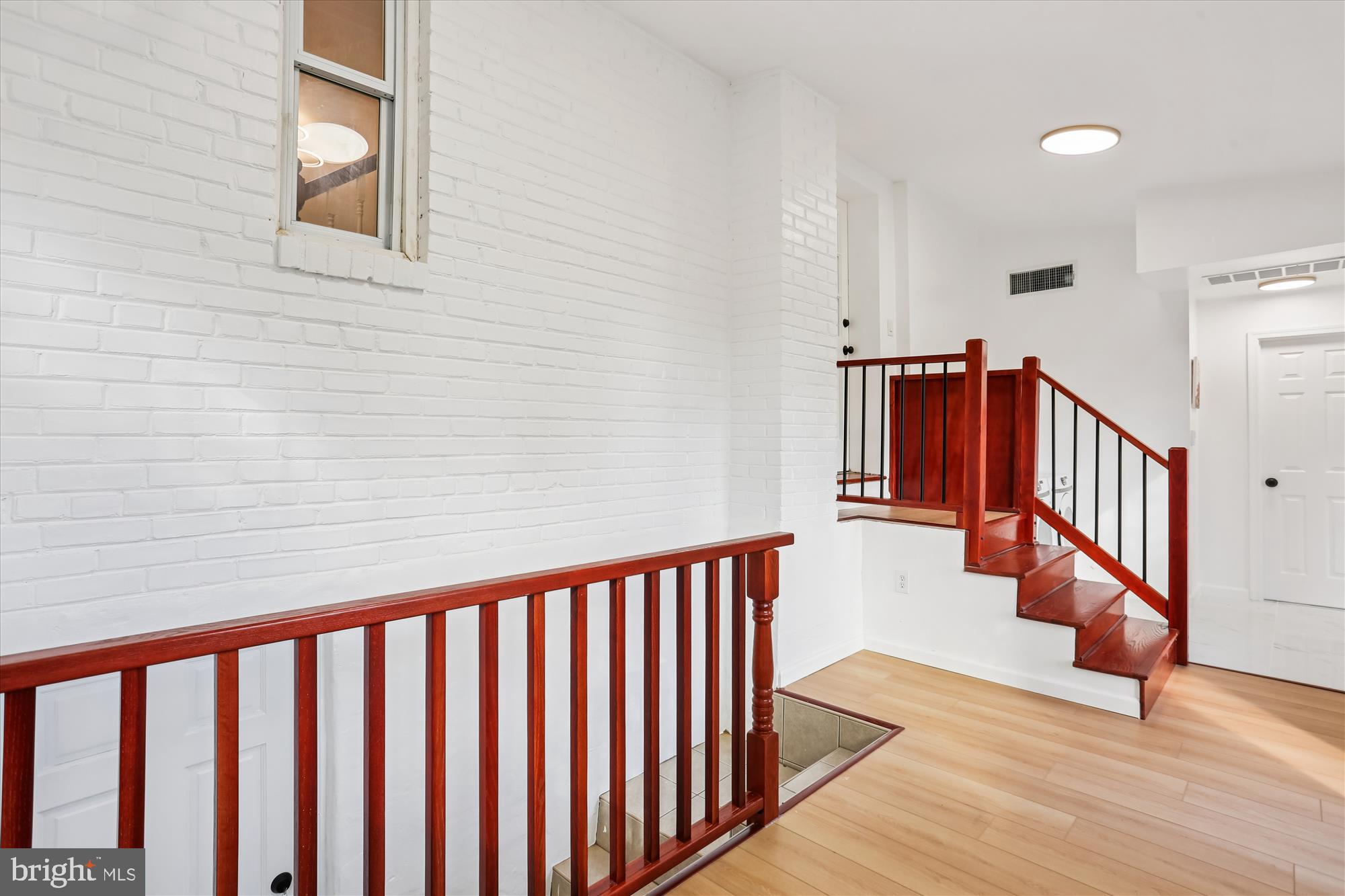 717 Ludlow Street Takoma Park, MD 20912 - Photo 17 of 68 a view of staircase with lots of wooden floor and windows