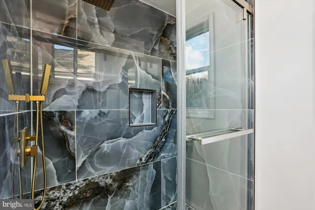 a bathroom with a sink a toilet and a bathtub