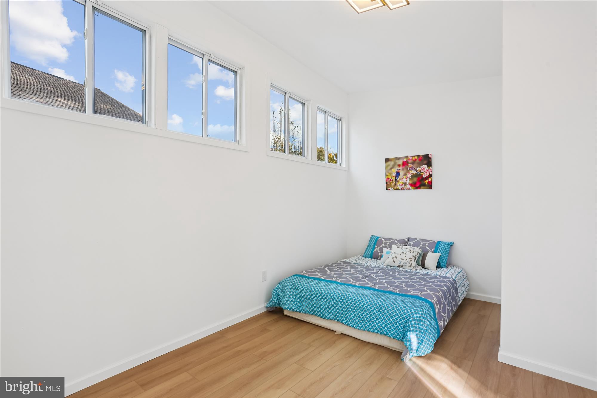717 Ludlow Street Takoma Park, MD 20912 - Photo 24 of 68 a bedroom with a bed and wooden floor