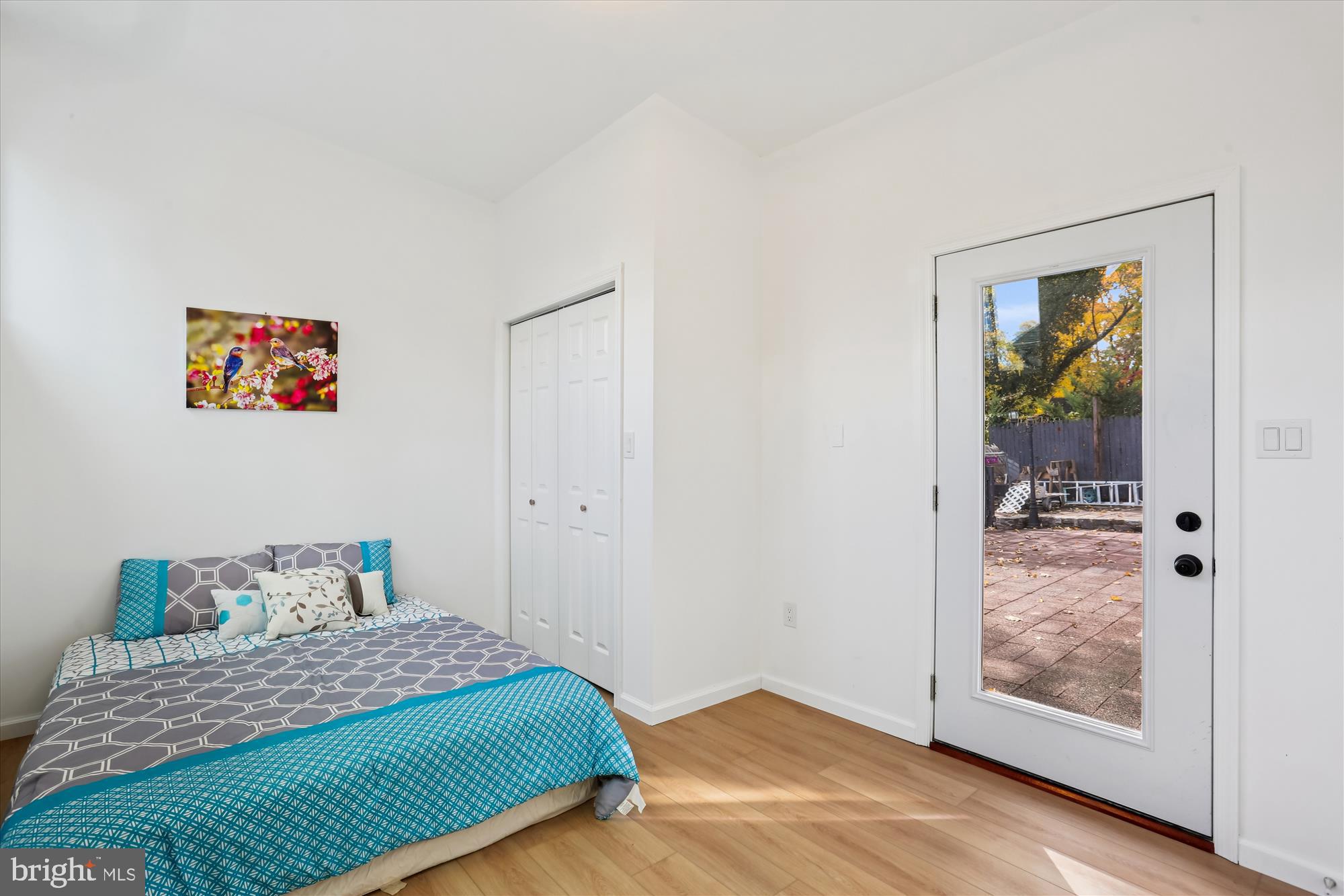 717 Ludlow Street Takoma Park, MD 20912 - Photo 25 of 68 a bedroom with a bed and painting on the wall