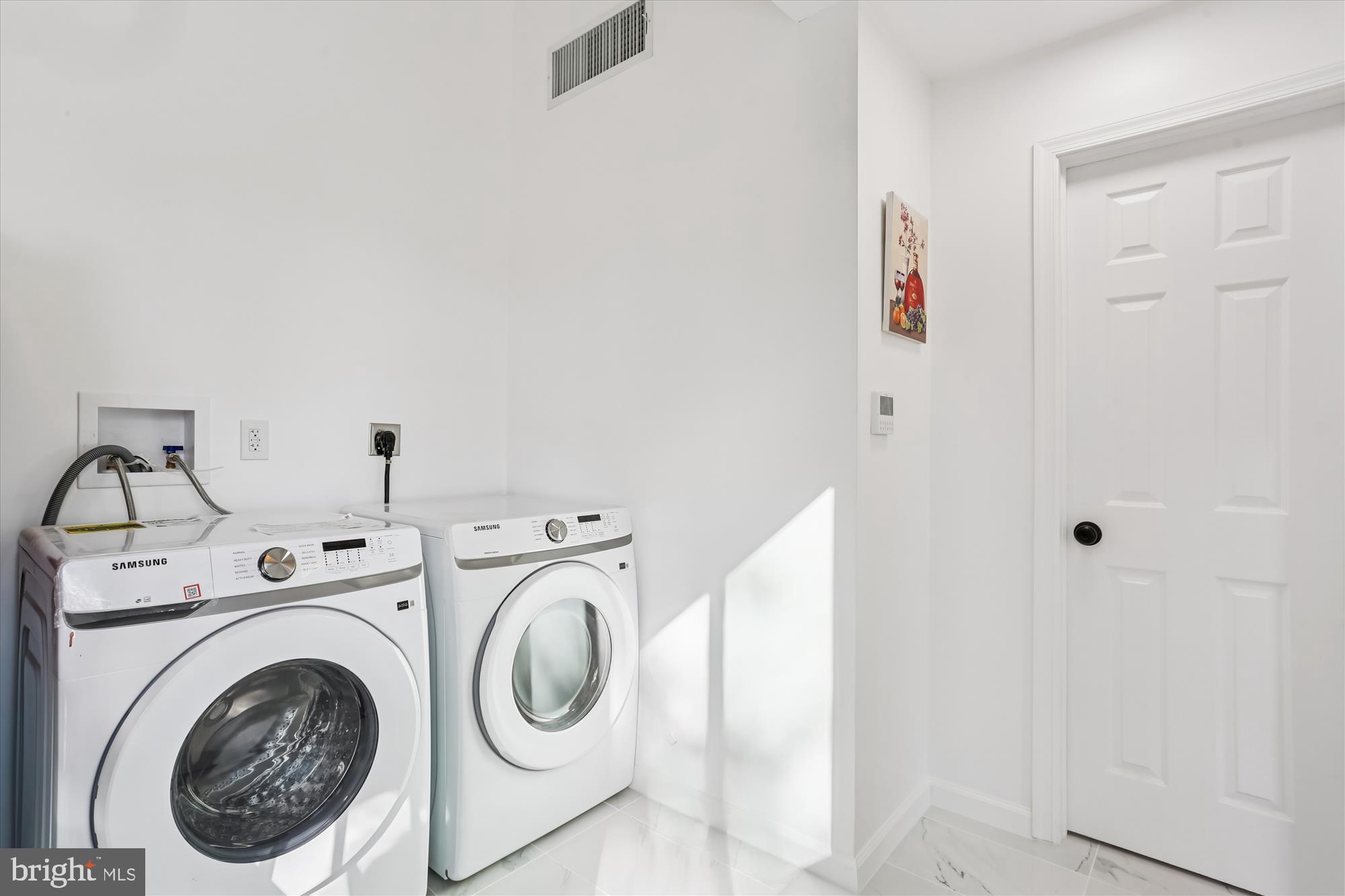 717 Ludlow Street Takoma Park, MD 20912 - Photo 29 of 68 a utility room with dryer and washer