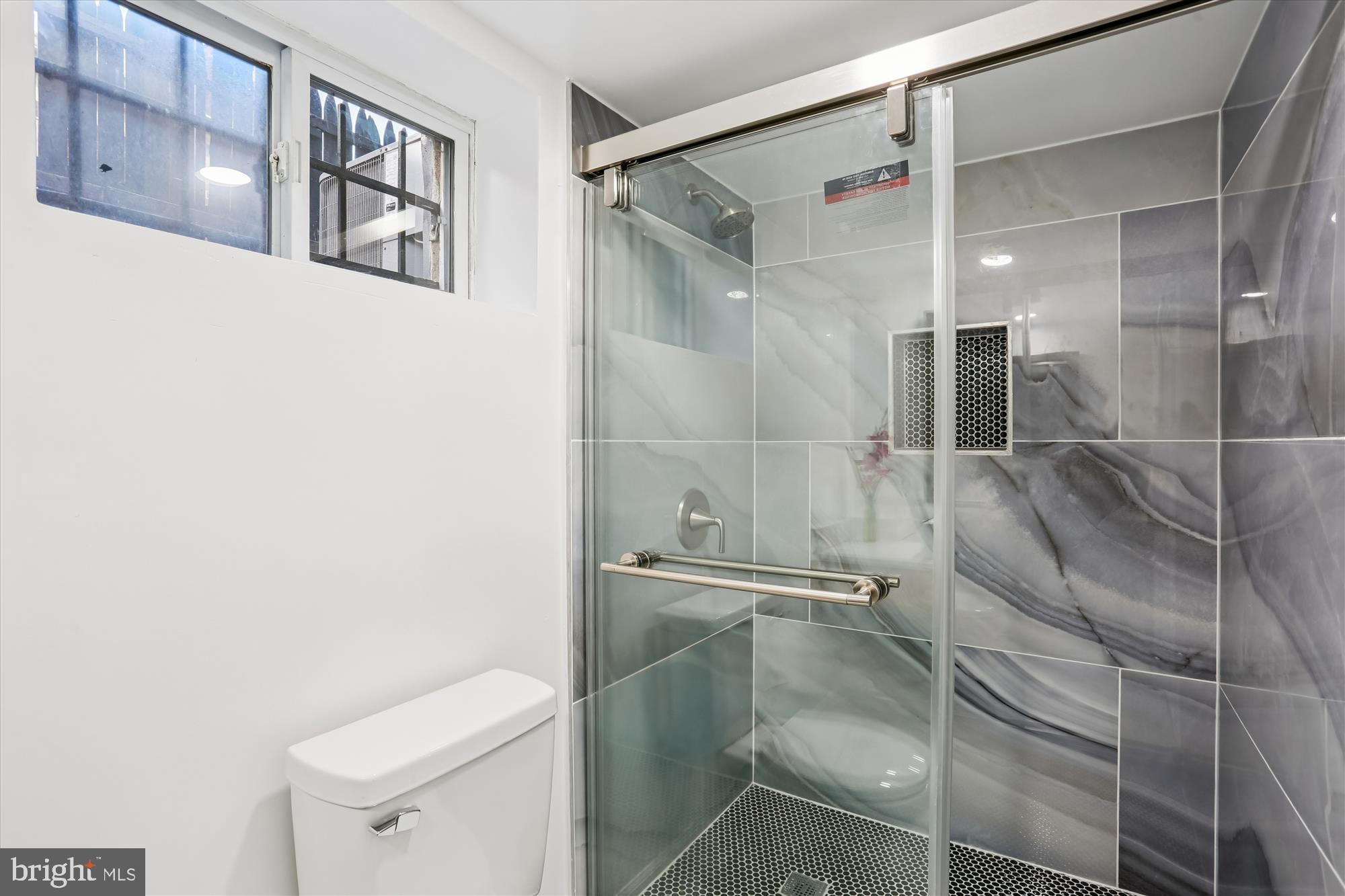 717 Ludlow Street Takoma Park, MD 20912 - Photo 43 of 68 a bathroom with a shower