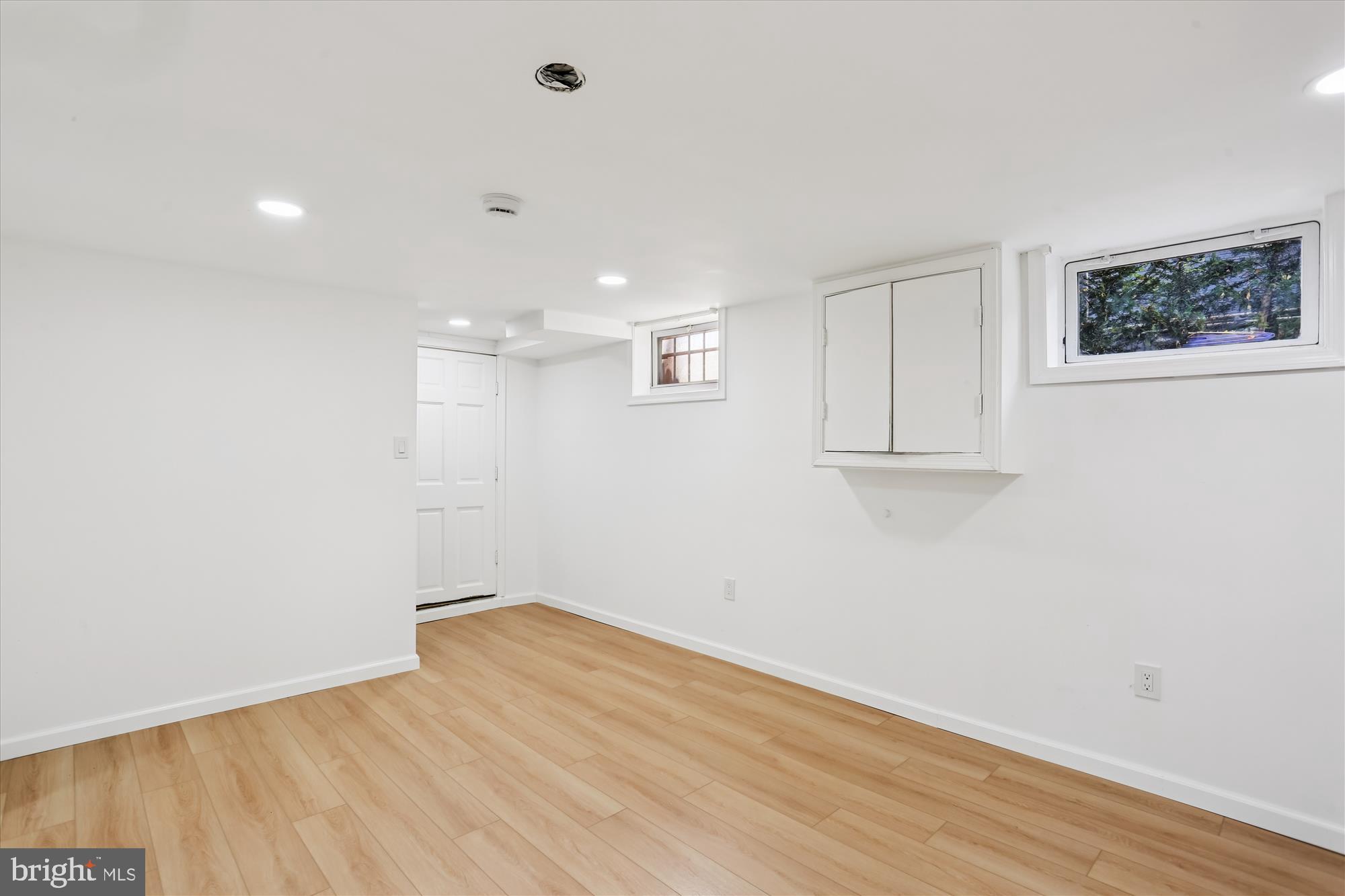 717 Ludlow Street Takoma Park, MD 20912 - Photo 45 of 68 a view of a room with wooden floor and white walls