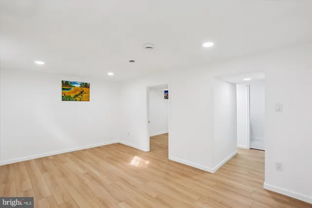 a view of a chairs and table in the back yard of the house