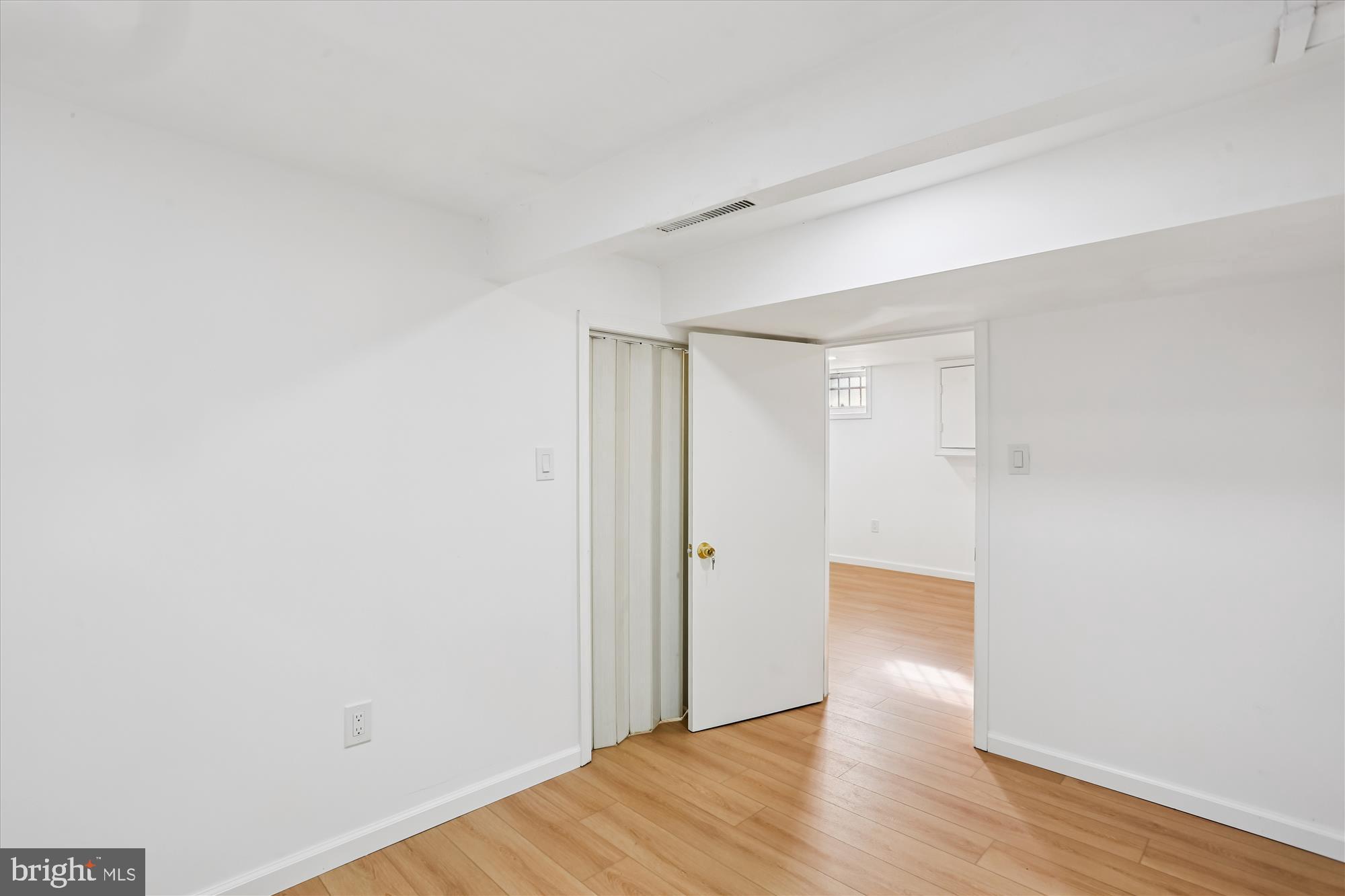 717 Ludlow Street Takoma Park, MD 20912 - Photo 50 of 68 a view of an empty room with wooden floor