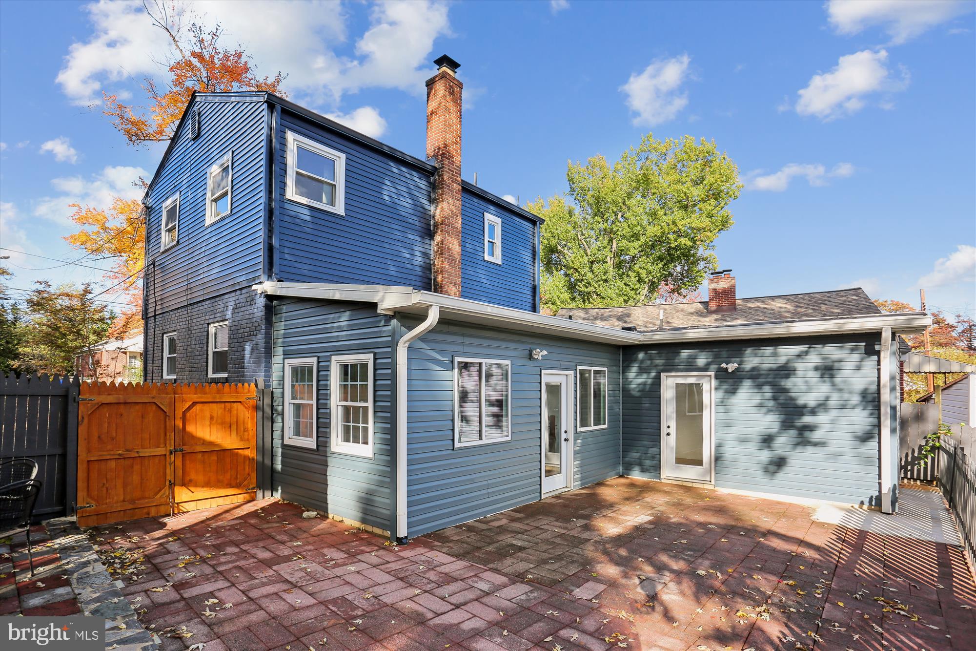 717 Ludlow Street Takoma Park, MD 20912 - Photo 53 of 68 Rear Elevation with Expansive Brick Patio