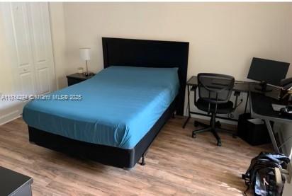 6001 Southwest 70th Street, Unit 252 South Miami, FL 33143 - Photo 11 of 15 a bedroom with a bed and a desk