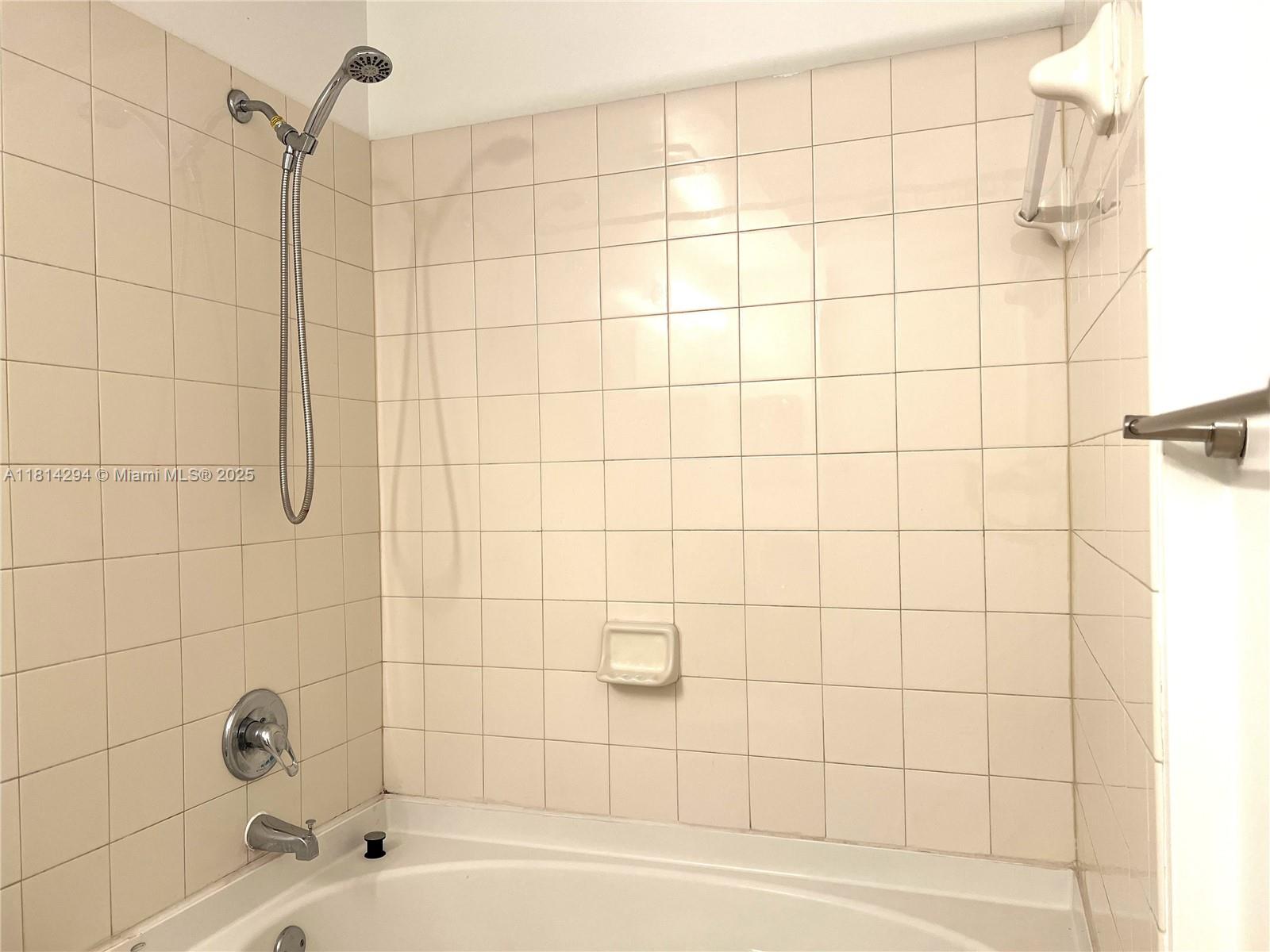 6001 Southwest 70th Street, Unit 252 South Miami, FL 33143 - Photo 14 of 15 a bathroom with a bathtub and shower