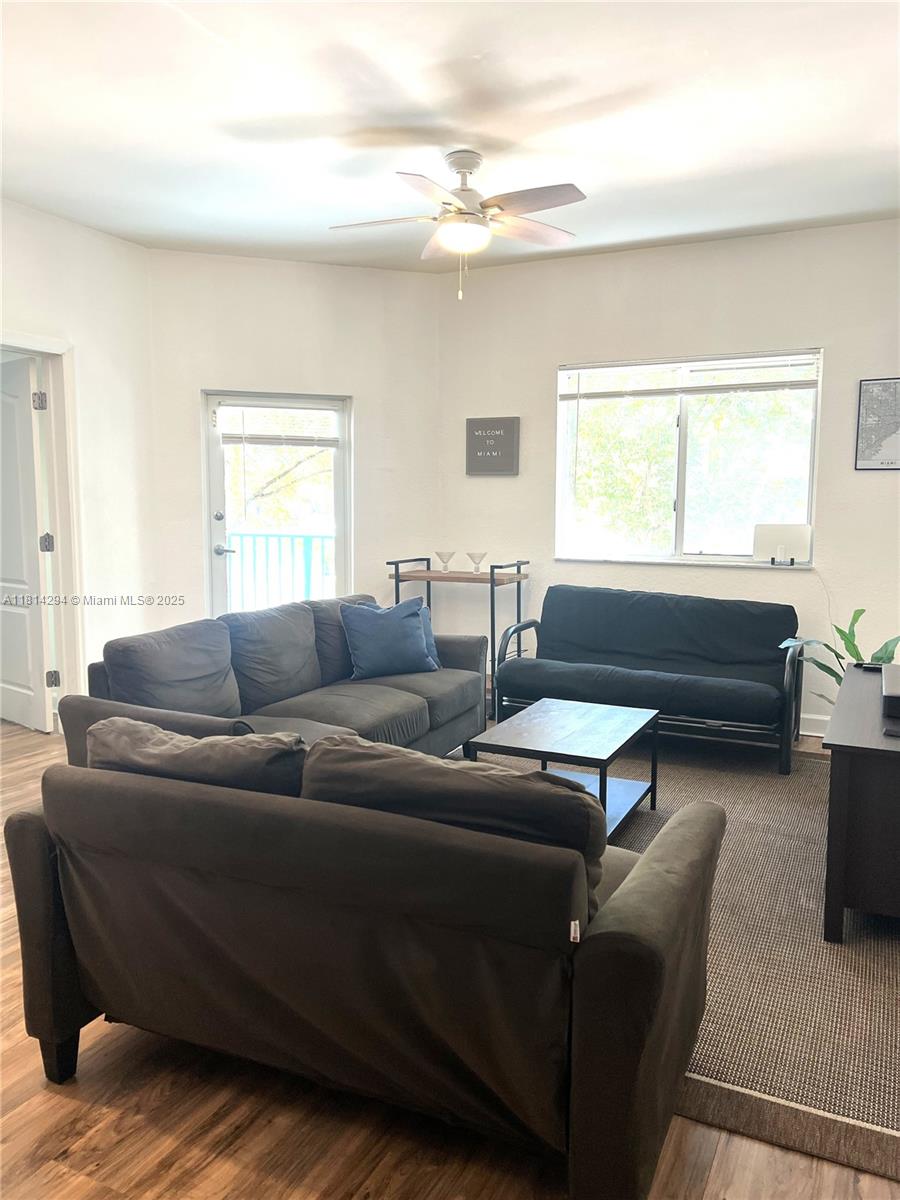 6001 Southwest 70th Street, Unit 252 South Miami, FL 33143 - Photo 6 of 15 a living room with furniture and a window