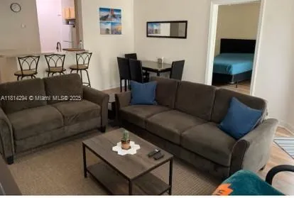 a living room with furniture and rug