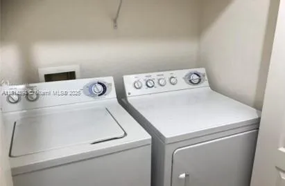 a utility room with dryer and washer
