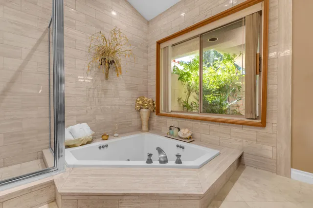 a bathroom with a bathtub and shower