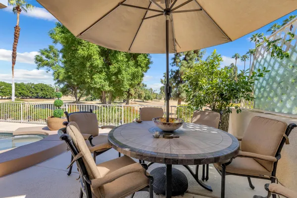 a view of a wooden deck with a big yard