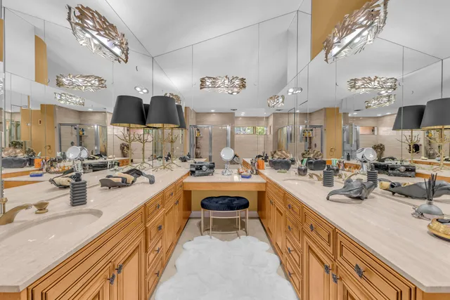 a large kitchen with kitchen island a large counter space a sink and appliances