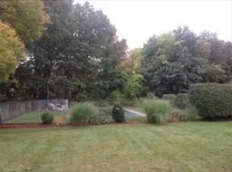 a view of walk in closet with clothes