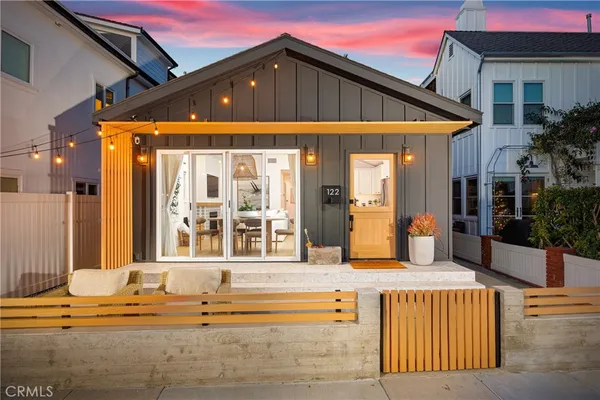 a front view of a house with a outdoor space