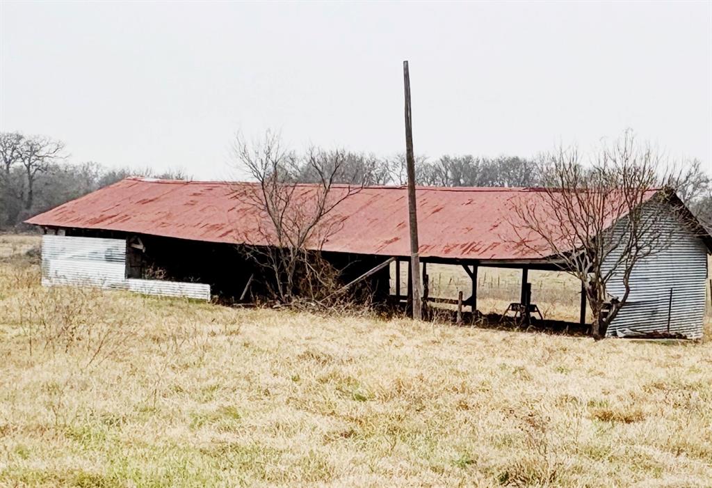 101 County Road 101 Marlin, TX 76661 - Photo 8 of 10 a view of a house with a yard covered in snow