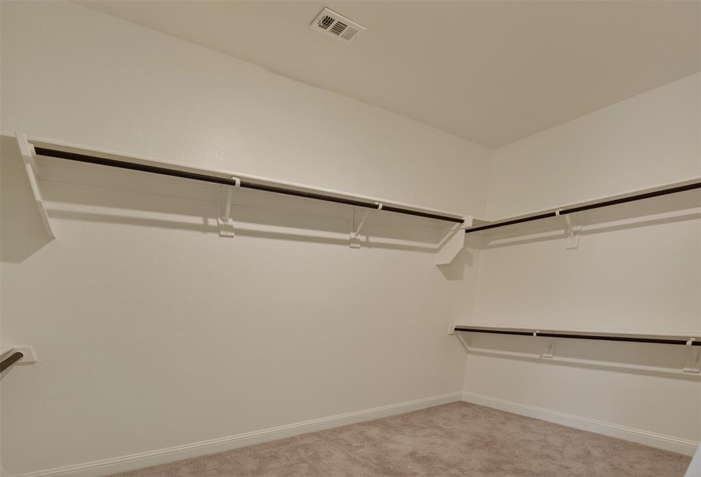 16812 Bitterroot Road Justin, TX 76247 - Photo 24 of 27 a view of a walk in closet