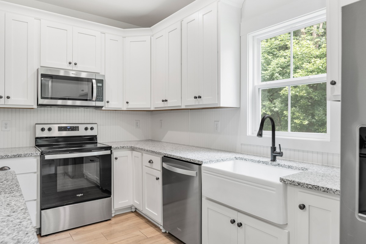 4486 Beards Chapel Road Springfield, TN 37172 - Photo 20 of 54 a kitchen with white cabinets appliances and a sink