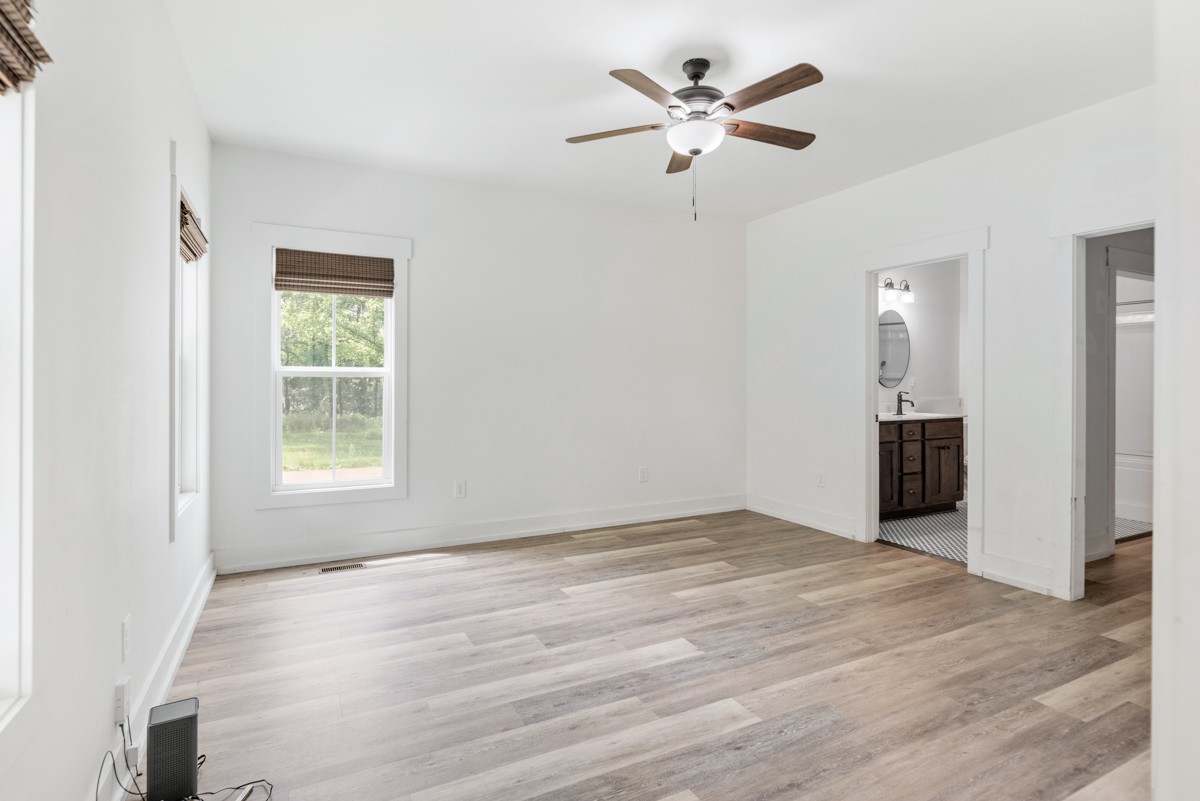 4486 Beards Chapel Road Springfield, TN 37172 - Photo 27 of 54 wooden floor in an empty room with a window