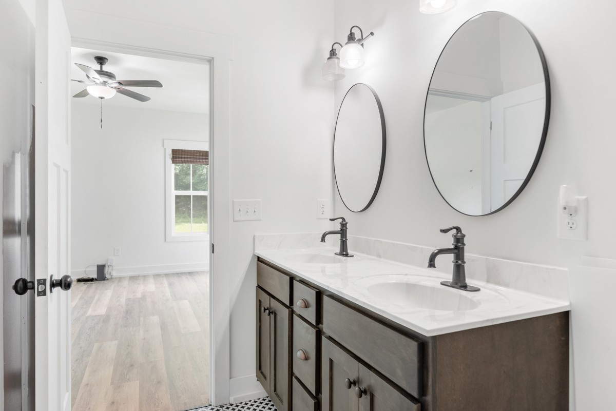 4486 Beards Chapel Road Springfield, TN 37172 - Photo 30 of 54 a bathroom with a sink and a mirror