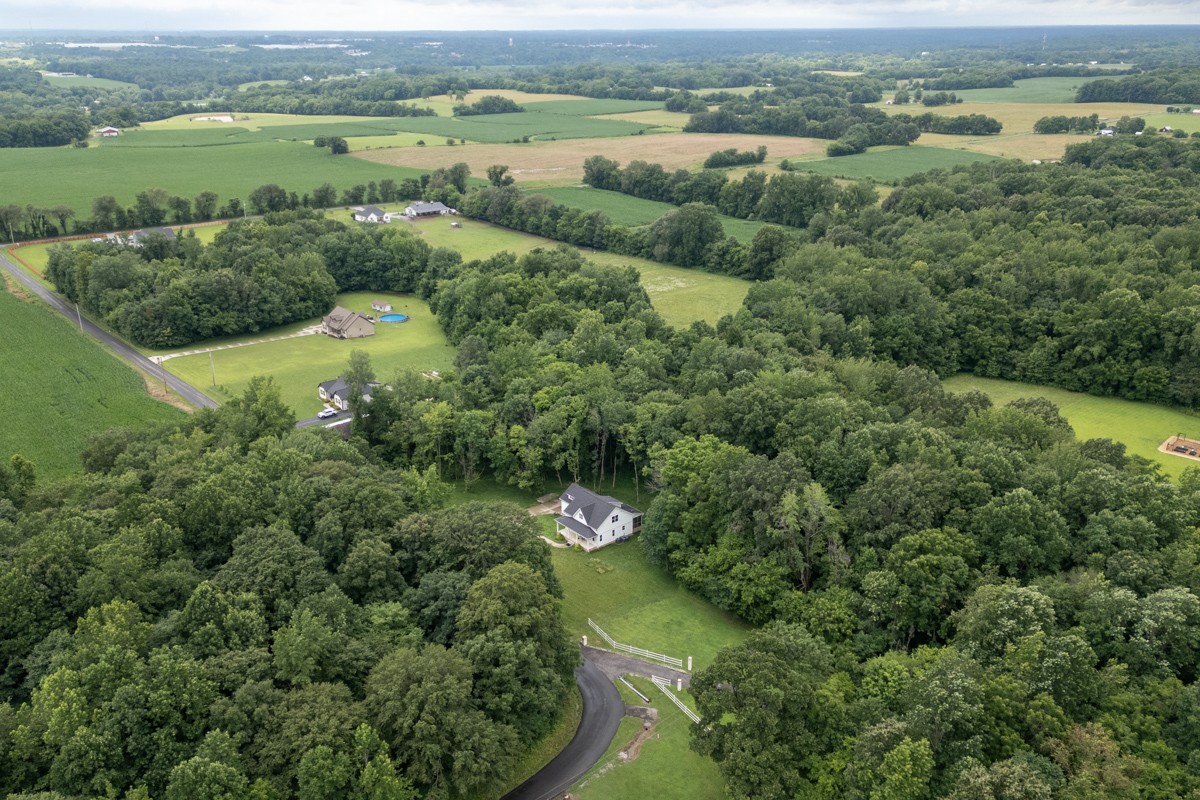 4486 Beards Chapel Road Springfield, TN 37172 - Photo 3 of 54 an aerial view of green landscape with trees houses and lake view