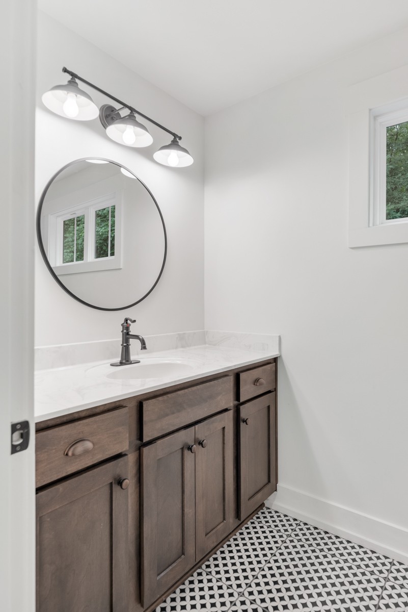4486 Beards Chapel Road Springfield, TN 37172 - Photo 35 of 54 a bathroom with a sink and a mirror