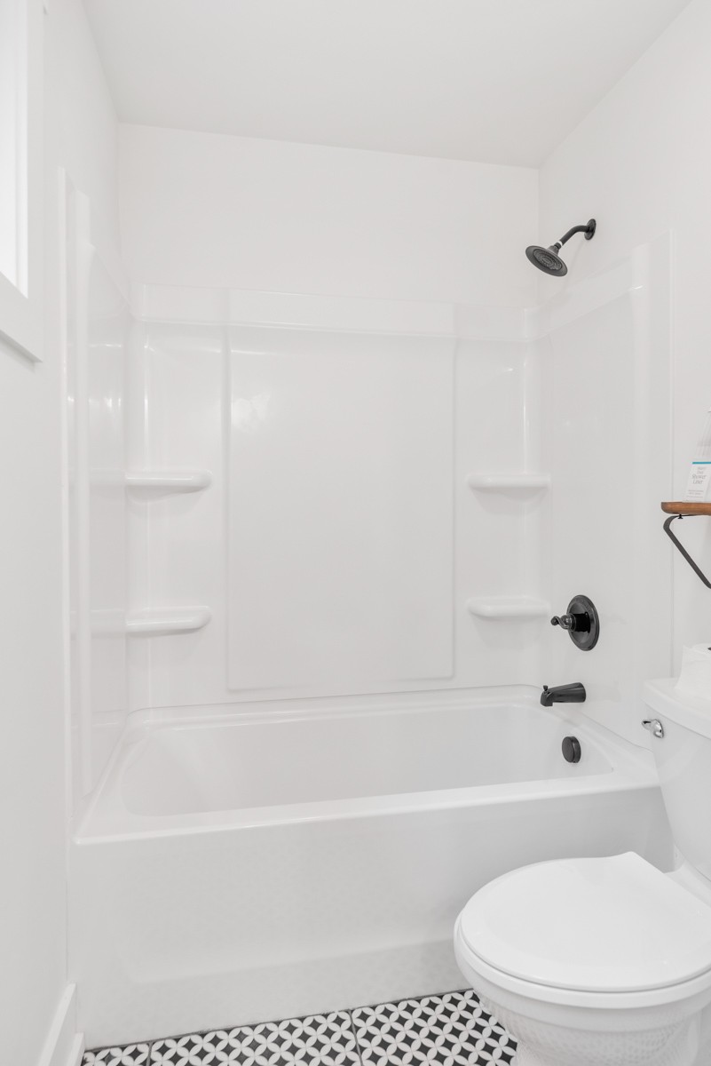 4486 Beards Chapel Road Springfield, TN 37172 - Photo 36 of 54 a bathroom with a bathtub and a toilet