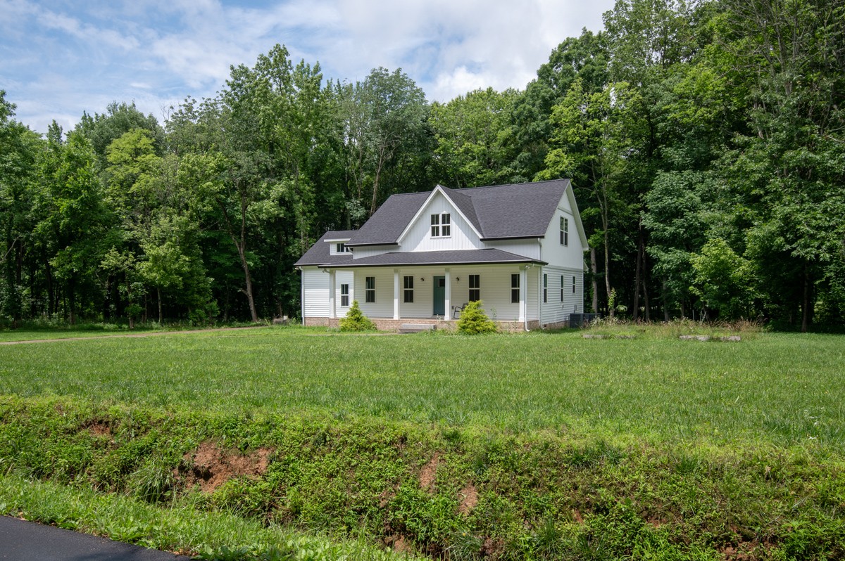 4486 Beards Chapel Road Springfield, TN 37172 - Photo 51 of 54 a view of a big house with a big yard and large trees