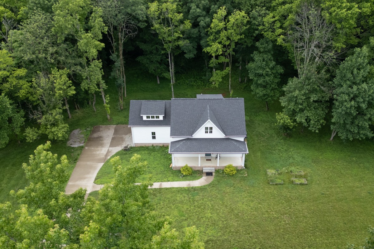4486 Beards Chapel Road Springfield, TN 37172 - Photo 7 of 54 front view of a house with a garden