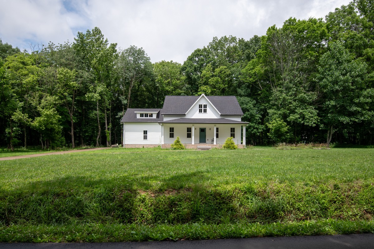 4486 Beards Chapel Road Springfield, TN 37172 - Photo 10 of 54 a view of a house with a big yard potted plants and large tree