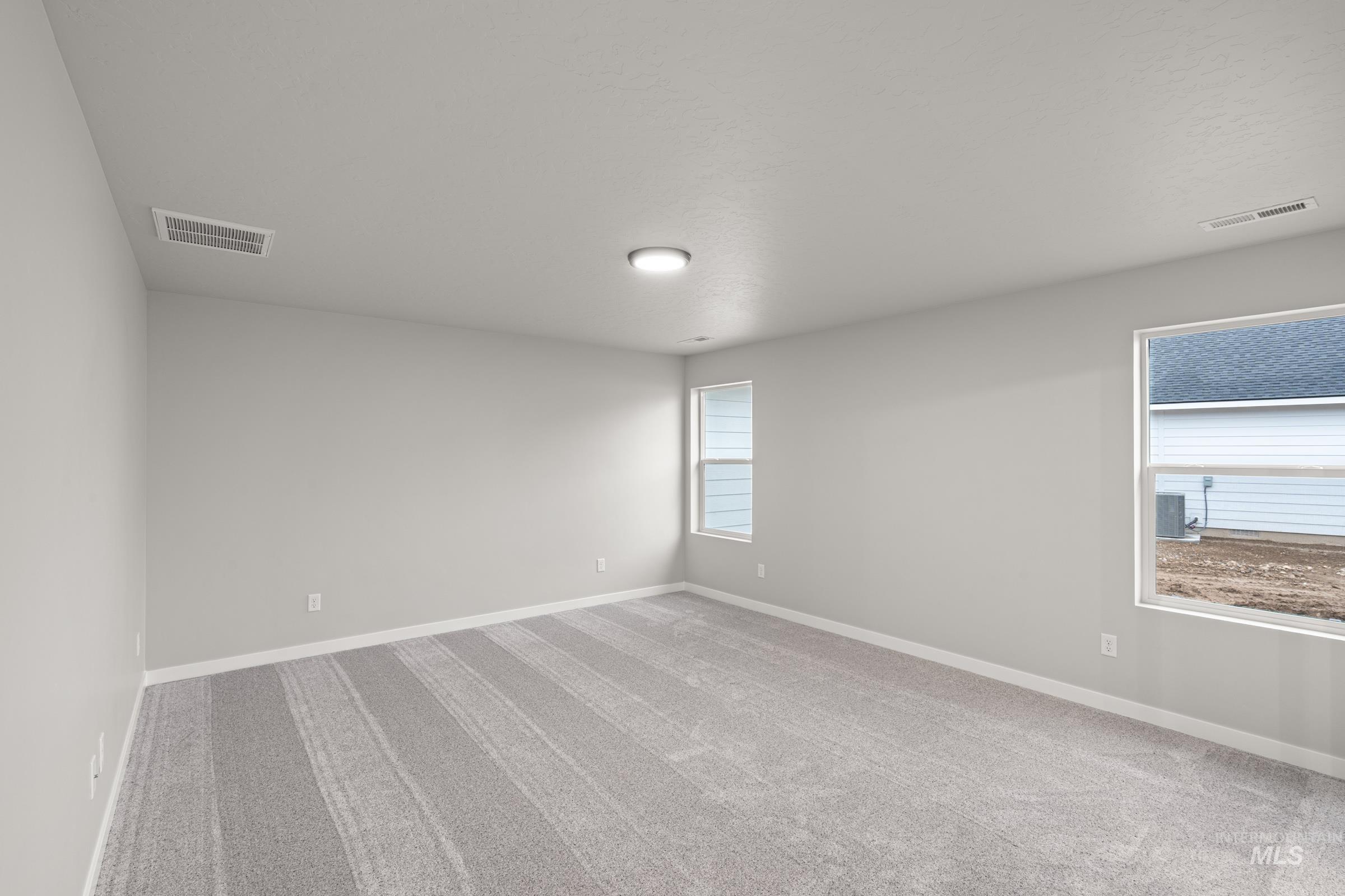 924 Northeast Trailridge Court Mountain Home, ID 83647 - Photo 15 of 21 Empty room featuring light carpet and baseboards