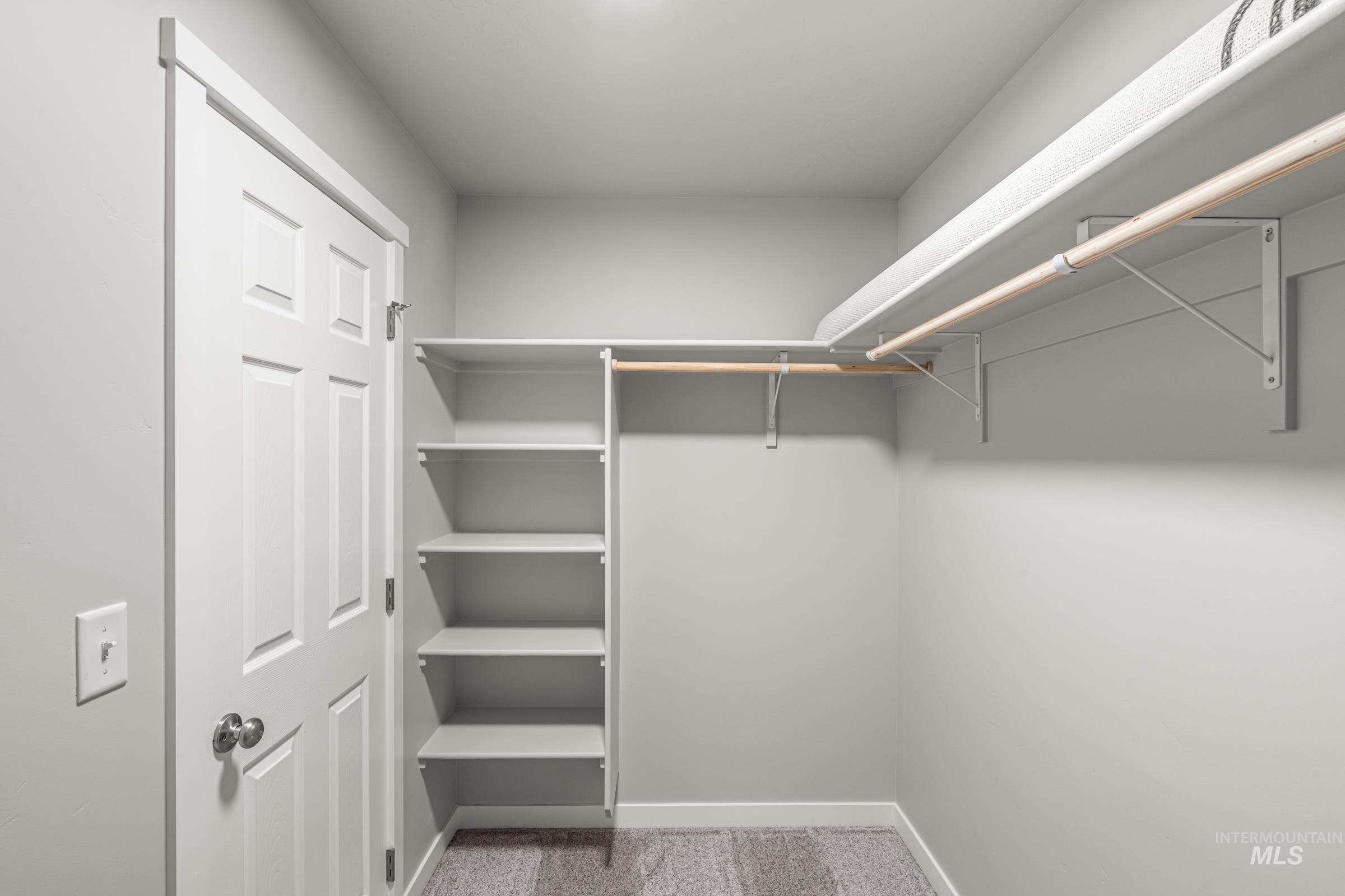 924 Northeast Trailridge Court Mountain Home, ID 83647 - Photo 18 of 21 Walk in closet with light carpet