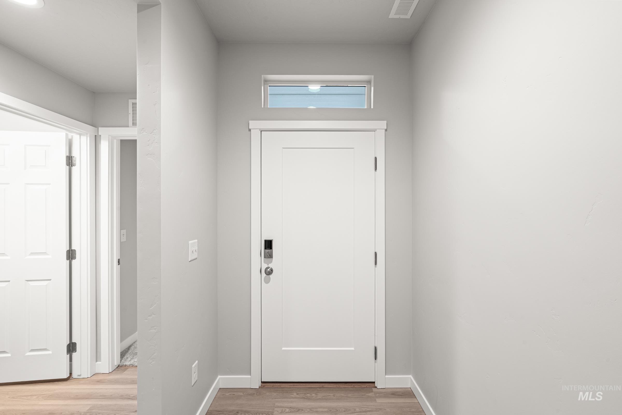 924 Northeast Trailridge Court Mountain Home, ID 83647 - Photo 2 of 21 Entryway featuring wood finished floors and baseboards