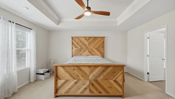 a view of a hallway with bathroom