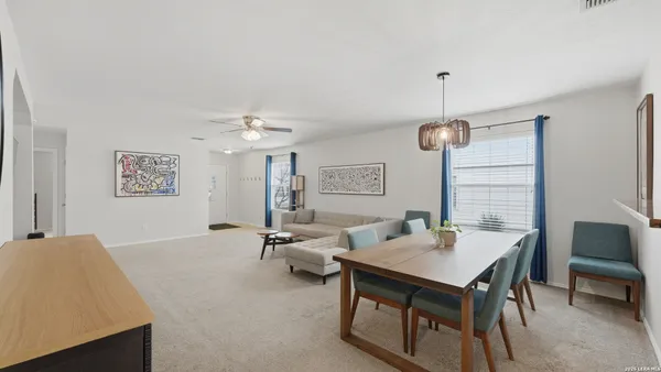 a living room with furniture and a table