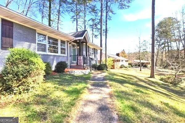 front view of a house with a yard